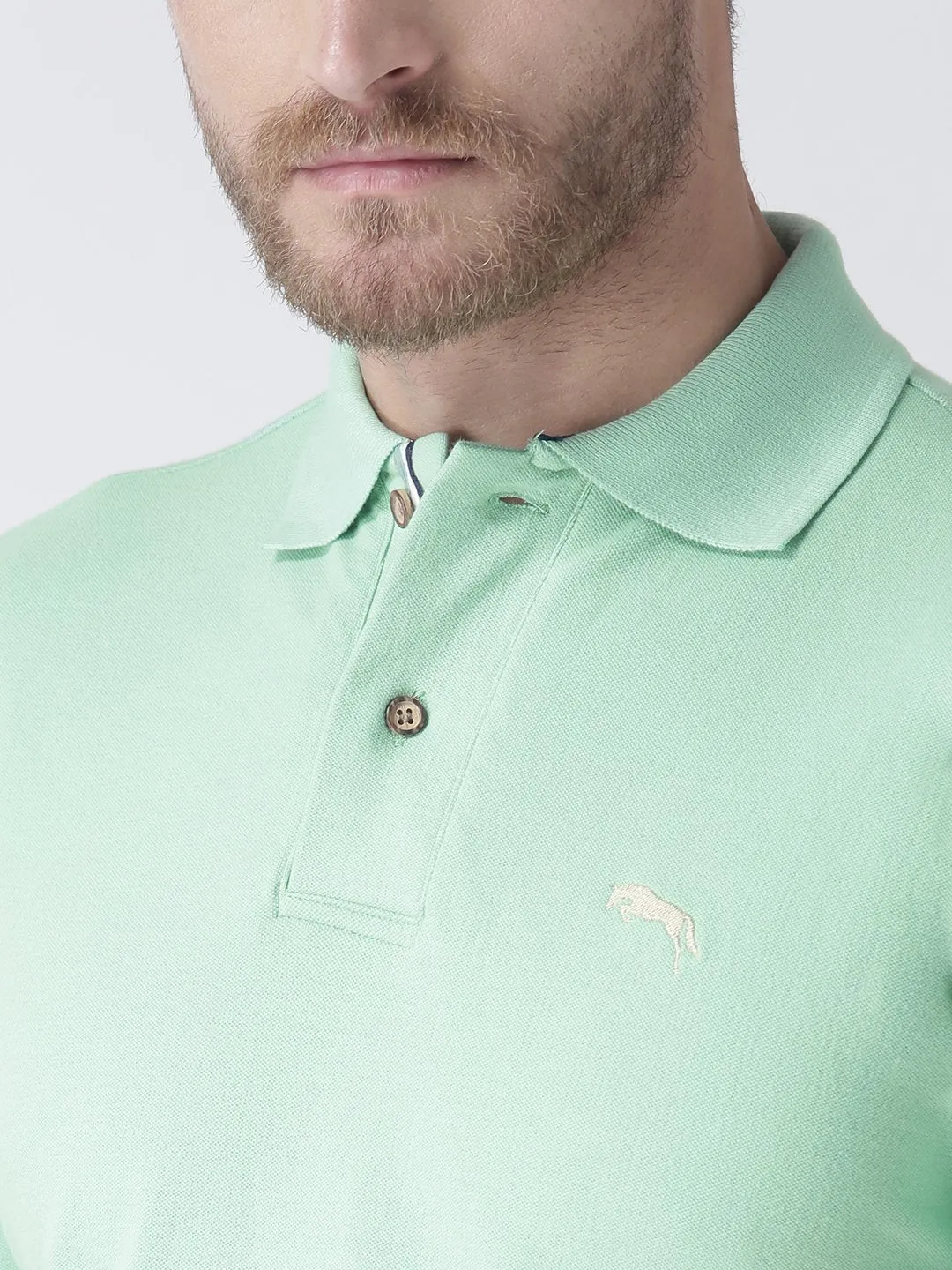 Men Green Solid Polo Collar T-Shirt